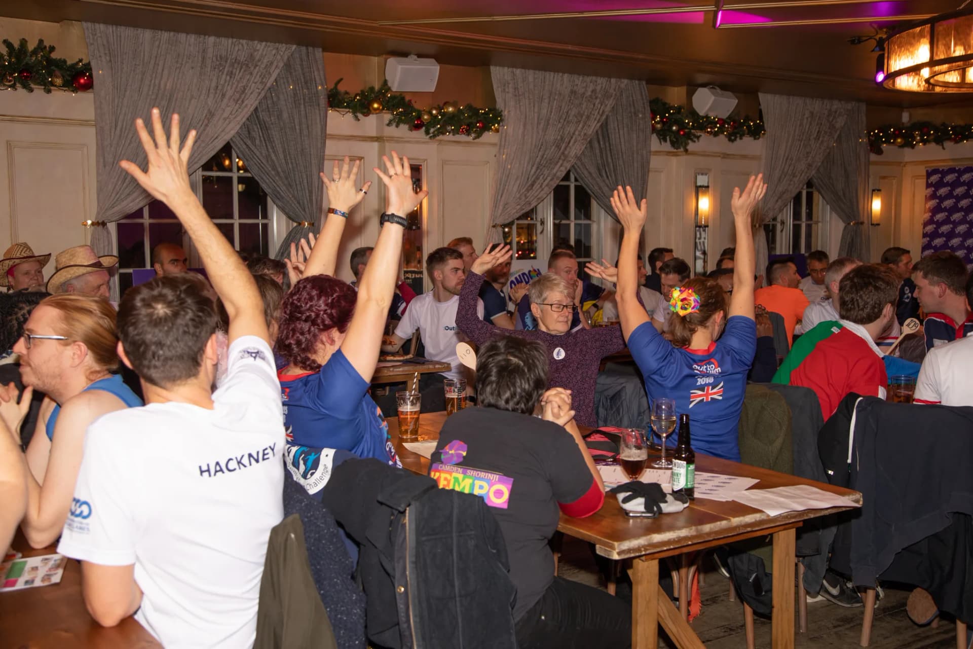 Guests throwing their hands up in celebration.